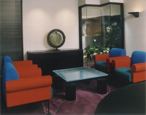 Corporate lounge with bold color-blocked upholstered seating