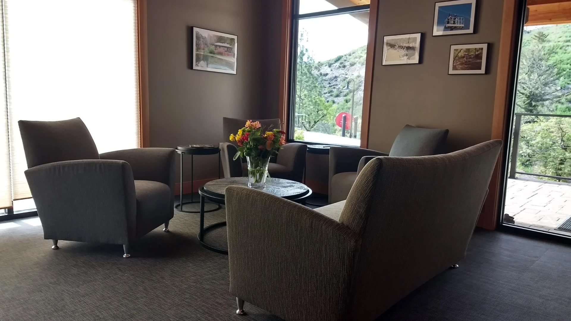 Boutique inn lounge with mountain views and contemporary club chairs