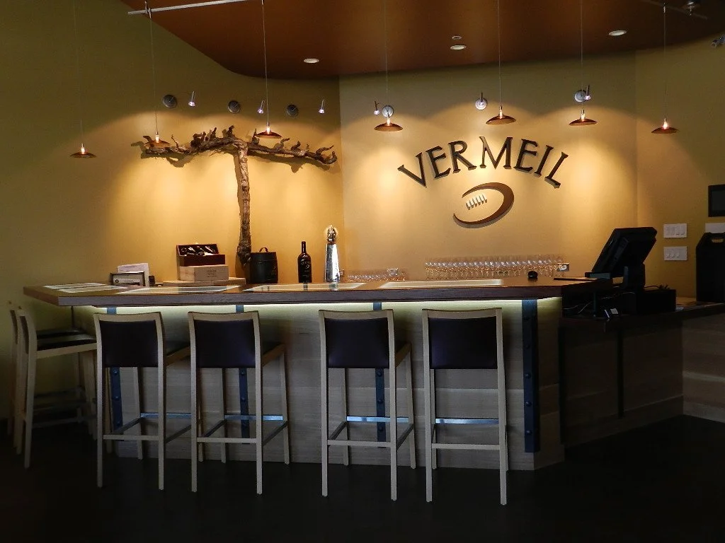 Vermeil Wines tasting room with grapevine sculpture and custom bar